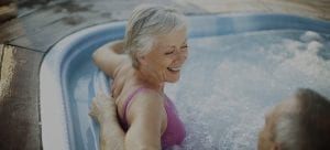 Older lady enjoying hot tub from Splashworks Pool & Spa